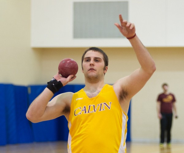 Aaron Meckes hoists the shotput.  calvin.edu