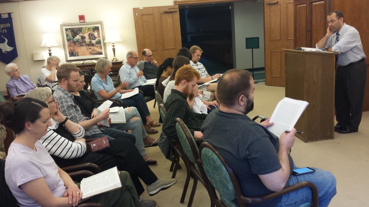 Professor Noe draws on scripture and John Calvin’s writing as he leads a study on suffering.  Photo courtesy David Noe.