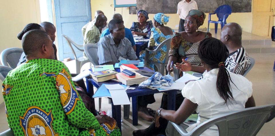 Group members discuss ways to promote peace and healing. Photo courtesy World Renew.