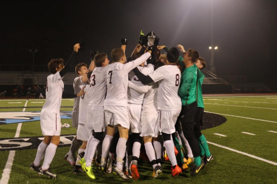 The men’s soccer team celebrates after they clinch MIAA title by beating Adrian College.
Photo courtesy Calvin Sports Information.