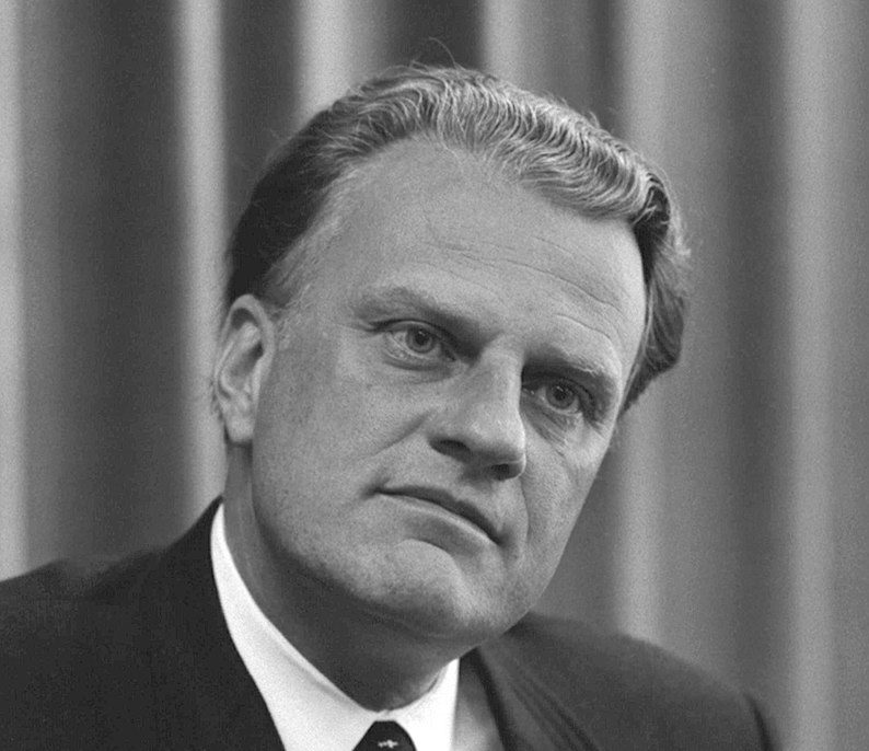Reverend Billy Graham drew massive crowds at his crusades which would end with a call for the crowd to accept Jesus. Photo cropped from Wikimedia Commons author Warren K. Leffler, and is found in the Library of Congress.