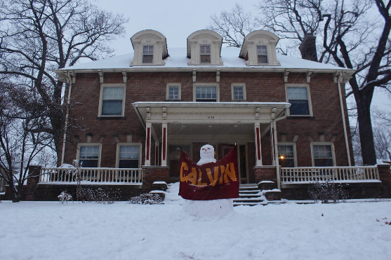 Koinonia House in Project Neighborhood 
“Most people including the two little ones who live in our house were so excited when it snowed during interim break and thought it was the perfect opportunity to get out of the house and make a snowman that people could see as they drove by our house, or something to smile at as they were stuck in traffic. We also wanted people to know we we're a Calvin house so we found the Calvin flag in our closet and had the snowman hold it!”