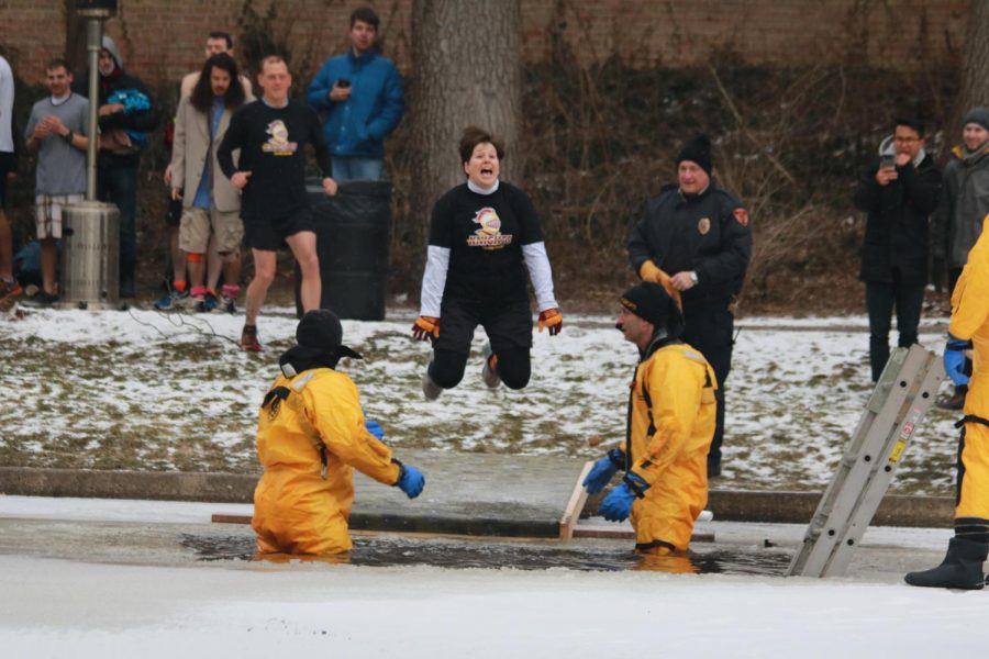 Pastor Mary participates in the Calvin tradition of jumping into the seminary pond in the middle of winter. Photo from the Chimes Archives. 