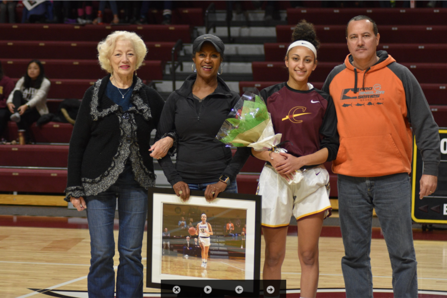 Sydney with her family on senior night 