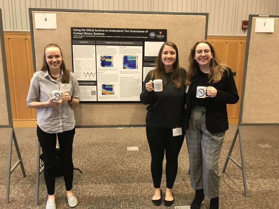 Senior Michaela Blain, left, presents her research on the formation of contact binary stars at the Michigan Space Grand Consortium in October 2019