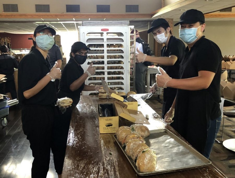 Knollcrest Dining team members pose around packaged cookies.