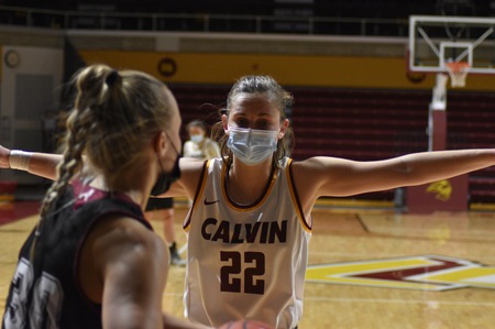 Junior Kamryn Elgersma guards an opponent. Masked play has taken some getting used to for players.