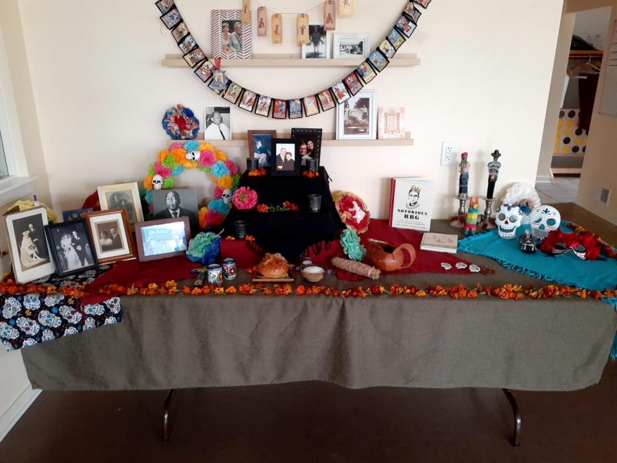 Naranjo’s ofrenda honoring passed loved ones featuring marigolds, John Lewis, and a book on Ruth Bader Ginsburg.