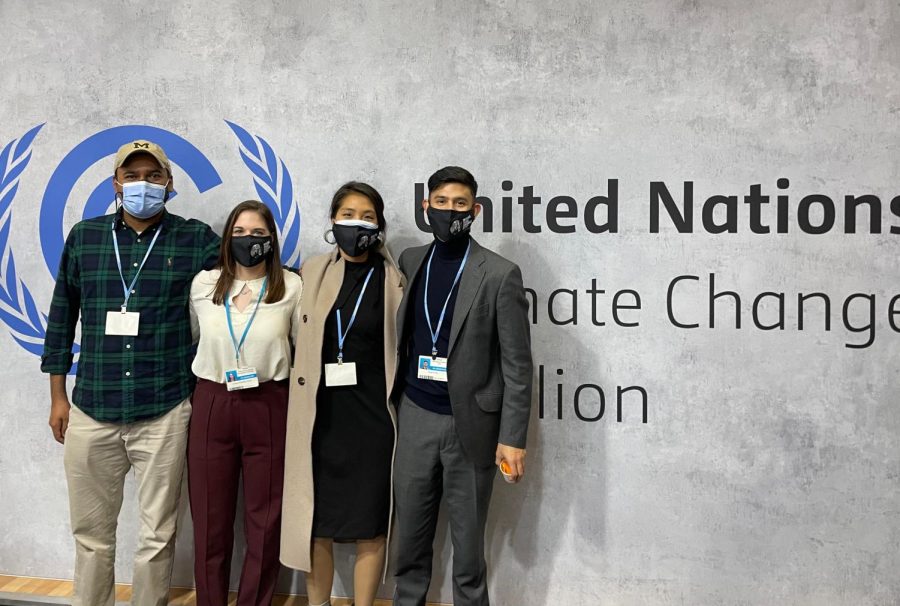 Yeri Kim, pictured second from right, along with two of her project teammates from the University of Michigan on her left and a UNFCCC participant on her right.