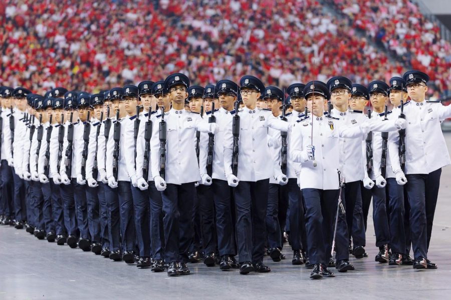 Kwik, pictured in the front row, second from the left, marching in the National Day parade in Singapore. As an 18-year old, he was commissioned as the police equivalent of first liutenant. 