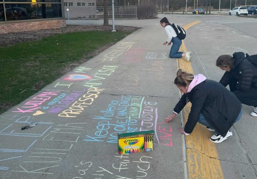 Students gathered outside the Prince Conference Center on Tuesday to chalk messages of support for social work professor Joseph Kuilema in advance of a board of trustees meeting this week. (Photo by Taryn Hoeksema)