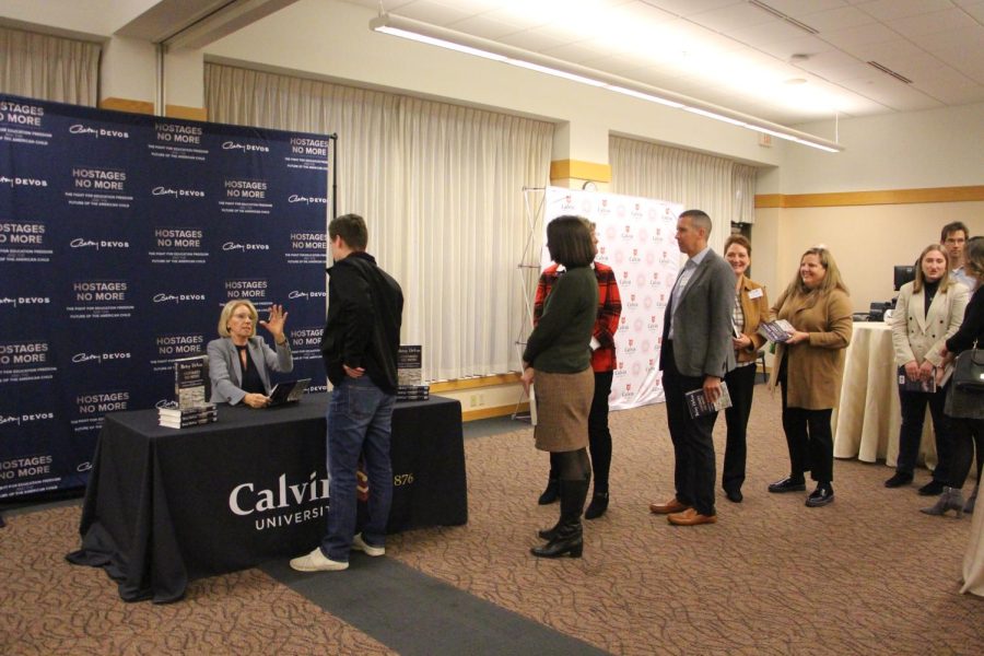 DeVos+signed+copies+of+her+most+recent+book+for+Calvin+community+members+at+the+Prince+Conference+Center+on+Nov.+17.