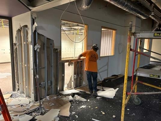  Demolition includes the “removal of ceilings, masonry, flooring, and mechanical elements.” Photo courtesy of Sarah Visser. 

