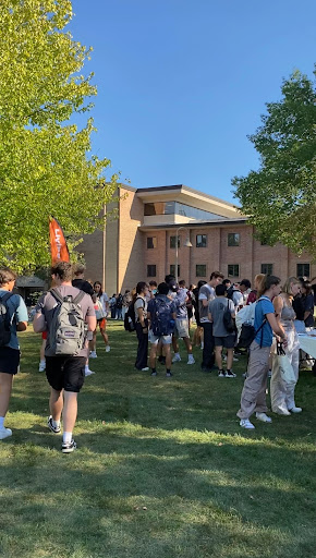 Students mill about on Commons Lawn at the church fair Sept. 6. Photo by Fiona Boerman.