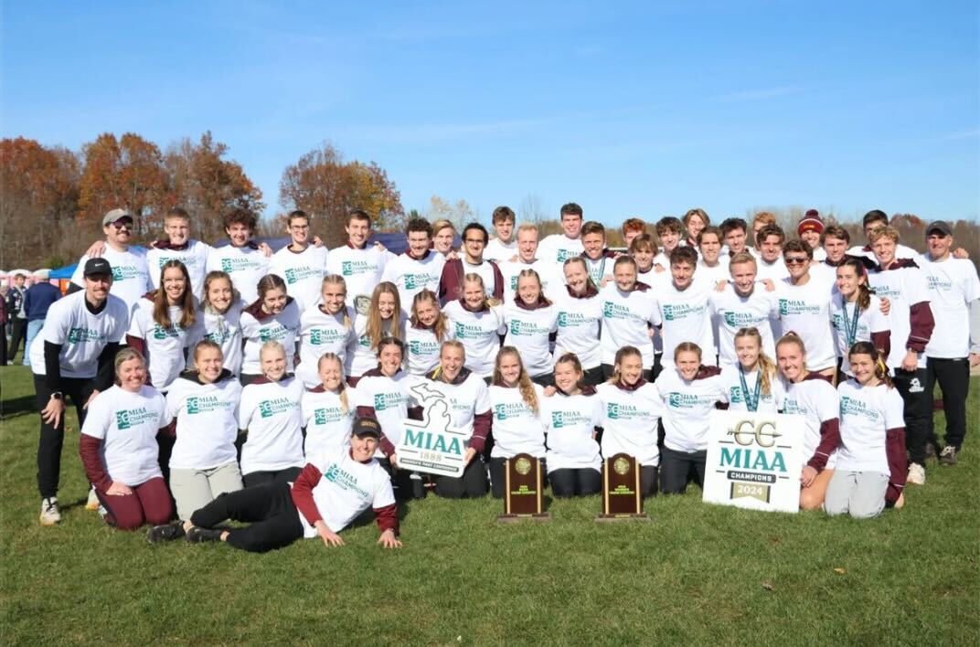 Calvin's cross-country team poses after conference meet. Photo from @calvin_xctf on Instagram.