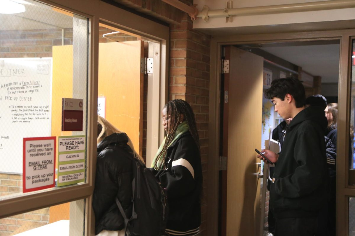 Students wait in line at the RVD package pick-up desk