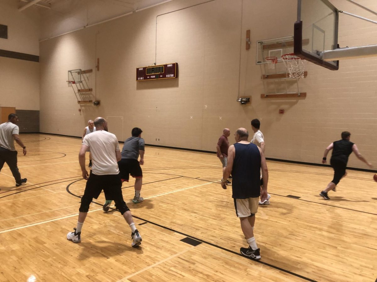 Professors play a lunchtime game of basketball. Photo courtesy of Micah Watson. 