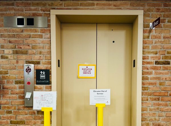 Signs have been posted in front of the elevator, which is next to the Heritage Hall archives, informing people not to use it. 