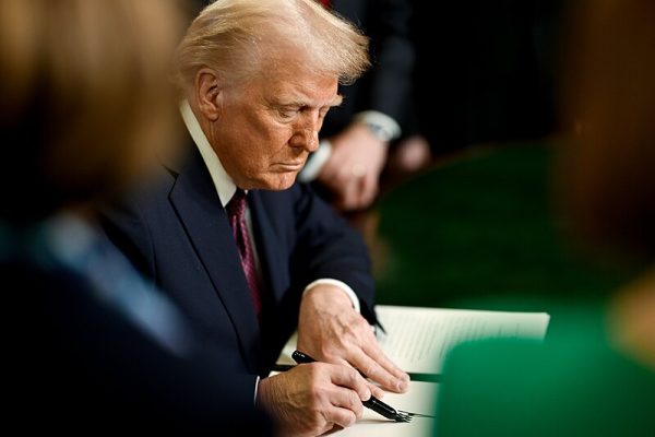 President Trump signs an executive order during his first term